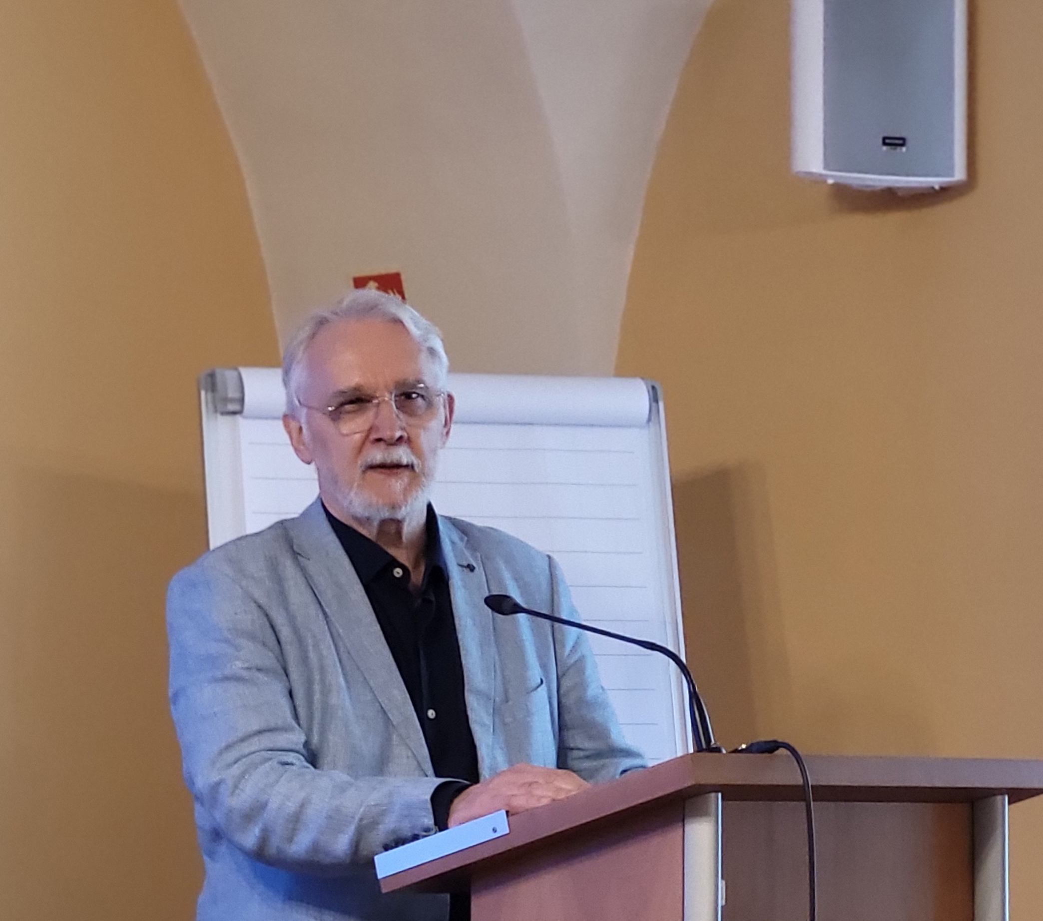 A scholar presenting their research